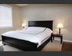Modern bedroom with queen size bed | Featured image for EasyCraft Easy VJ 150 wall panels.